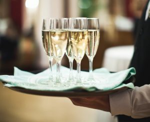 Waiter holding a tray of champagne flutes